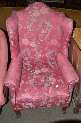 Lot 660 - A wing armchair