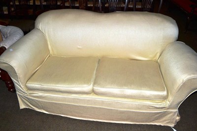 Lot 667 - A two seater settee with bold loose covers