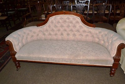 Lot 668 - A Victorian walnut framed button back settee with cream upholstery