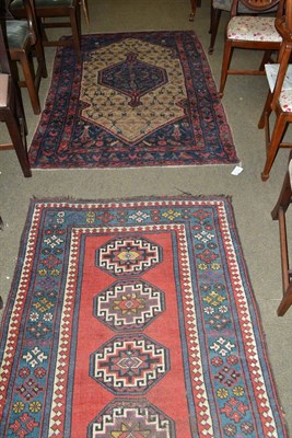 Lot 669 - Karabagh rug, South Caucasian, the madder field with a row of octagons enclosed by arrowhead...