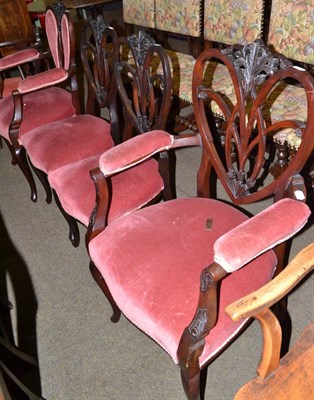 Lot 677 - A set of four Edwardian dark mahogany salon chairs, two with arms and an Edwardian mahogany...