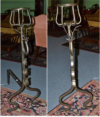 Lot 287 - A Pair of Large Andirons, in Tudor style, with basket finials over stags' heads and scroll brackets