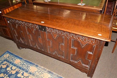 Lot 690 - An 18th century oak linen chest with geometric carved facia