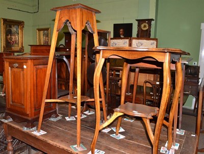 Lot 697 - An Edwardian walnut coal purdonium, a plant stand and an occasional table (3)