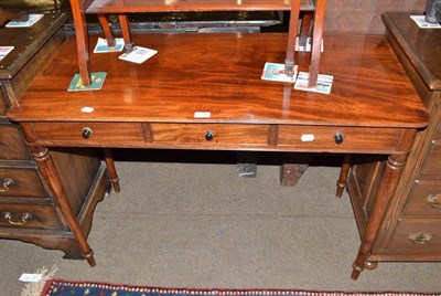 Lot 704 - A 19th century mahogany three drawer side table