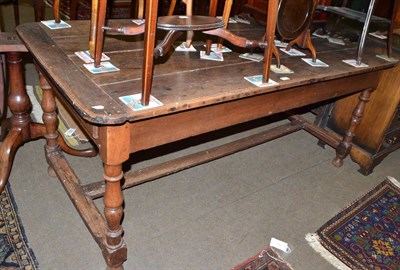 Lot 706 - A 19th century French provincial elm top kitchen table