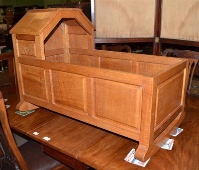 Lot 717 - A Bob ";Wrenman"; Hunter panelled oak cradle, with recessed wren signature