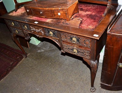 Lot 720 - A Chippendale revival carved mahogany desk on claw feet