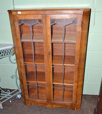 Lot 724 - An Art Deco mahogany display cabinet with leaded stained glass doors