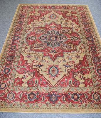 Lot 1275 - Machine Made Rug, the pale camel field with a...