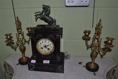 Lot 728 - A black slate clock garniture