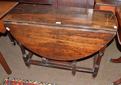 Lot 737 - An 18th century oak gate leg table