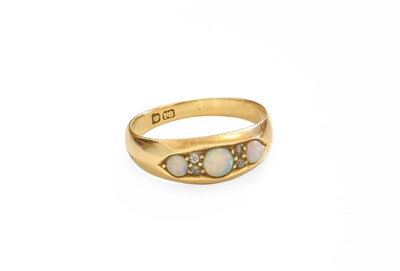 Lot 116 - An Opal and Diamond Ring, three round cabochon...