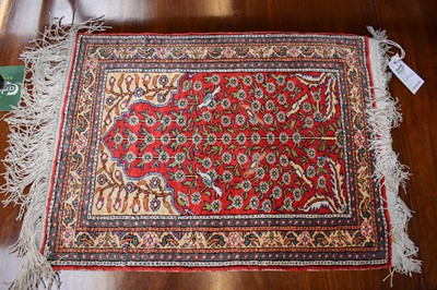 Lot 1289 - Kayseri Silk Prayer Rug, the brick red field...