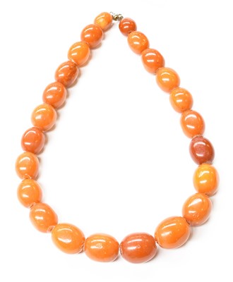 Lot 121 - An Amber Bead Necklace, comprising of...