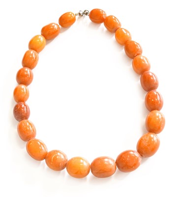 Lot 108 - An Amber Bead Necklace, comprising of...