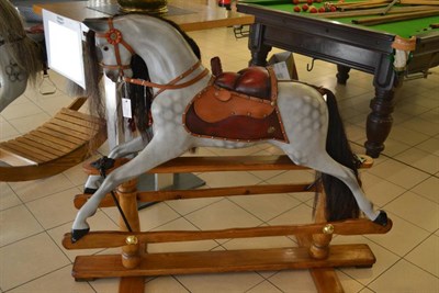 Lot 761 - Early 20th century, possibly by G & J Lines Ltd dapple grey rocking horse 'extra carved'...