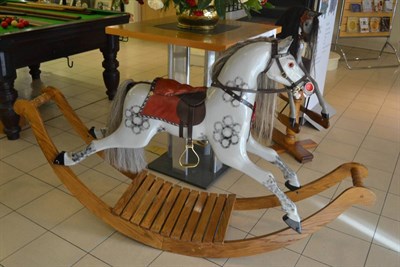 Lot 762 - Dapple grey rocking horse on rocker base, with leather tack, made by B Barker, West Yorkshire