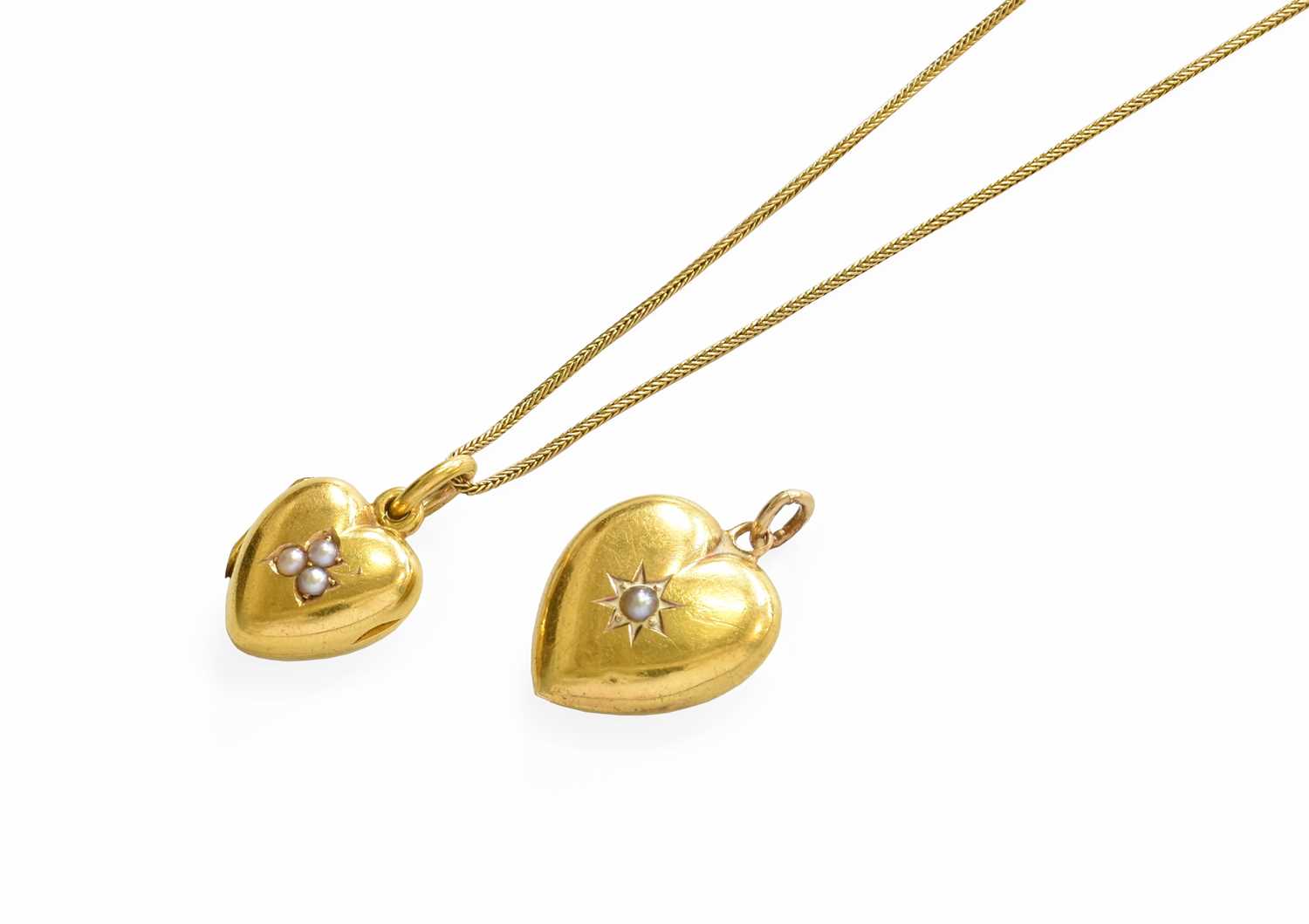 Lot 142 - A Split Pearl Locket on Chain, the heart