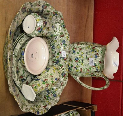 Lot 780 - A Staffordshire green pottery eight piece toilet set (a.f.)