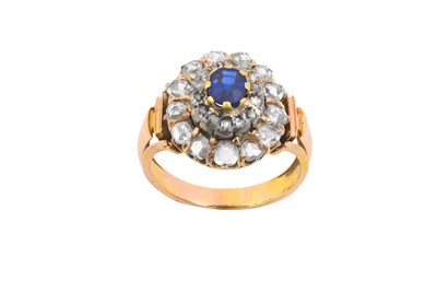 Lot 2102 - A Sapphire and Diamond Cluster Ring the oval...