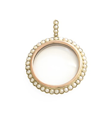 Lot 258 - A Split Pearl Locket, the circular locket...