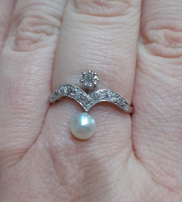 Lot 2062 - A Pearl and Diamond Ring the wishbone motif...