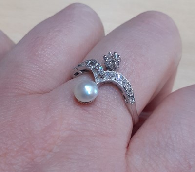 Lot 2062 - A Pearl and Diamond Ring the wishbone motif...