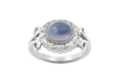 Lot 2026 - A Moonstone and Diamond Cluster Ring the oval...