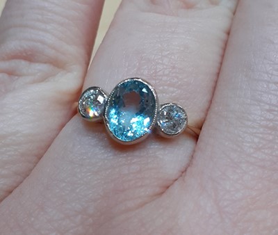 Lot 2032 - An Aquamarine and Diamond Three Stone Ring the...