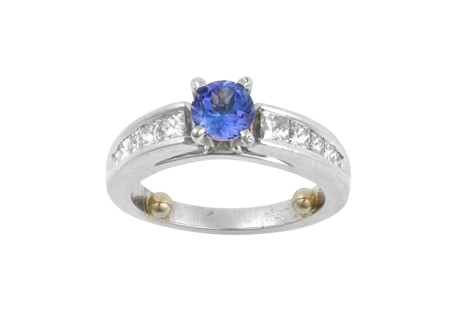 Lot 2007 - A Tanzanite and Diamond Ring the round cut...