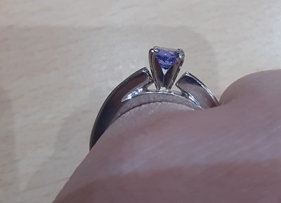 Lot 2007 - A Tanzanite and Diamond Ring the round cut...