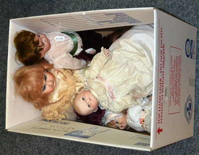 Lot 820 - Assorted doll's wicker and other furniture, oak cradle and modern and bisque head dolls, and...