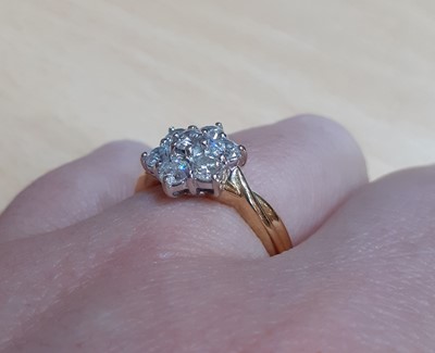 Lot 2079 - A Diamond Cluster Ring the central raised...