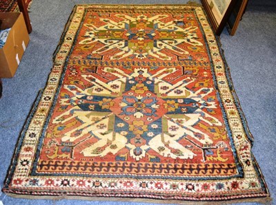 Lot 826 - Chelaberd rug, South Caucasus, the madder field with two 'eagle' medallions enclosed by narrow...