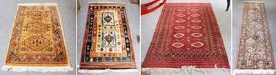 Lot 1214 - A Bukhara Rug, the deep brick red field with...