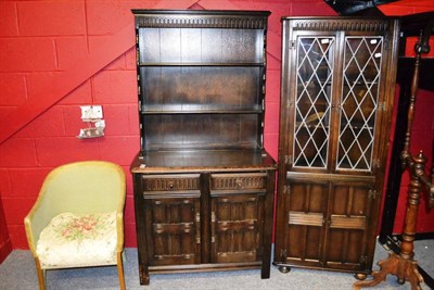 Lot 834 - Lloyd Loom style chair, oak floor standing corner cupboard and an oak dresser (3)