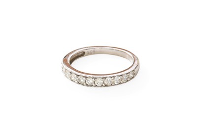 Lot 338 - A 9 Carat White Gold Diamond Half Hoop Ring,...