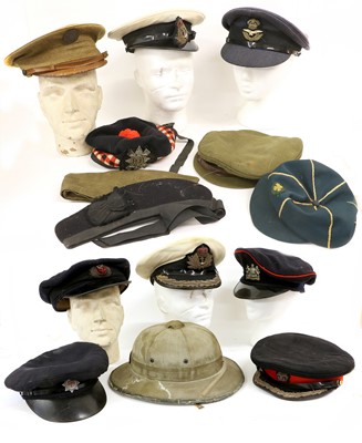 Lot 116 - A Collection of Fourteen Military Hats,...