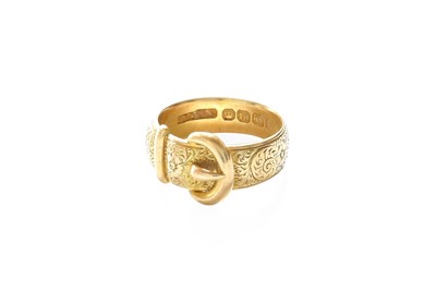 Lot 213 - An 18 Carat Gold Engraved Buckle Motif Ring,...