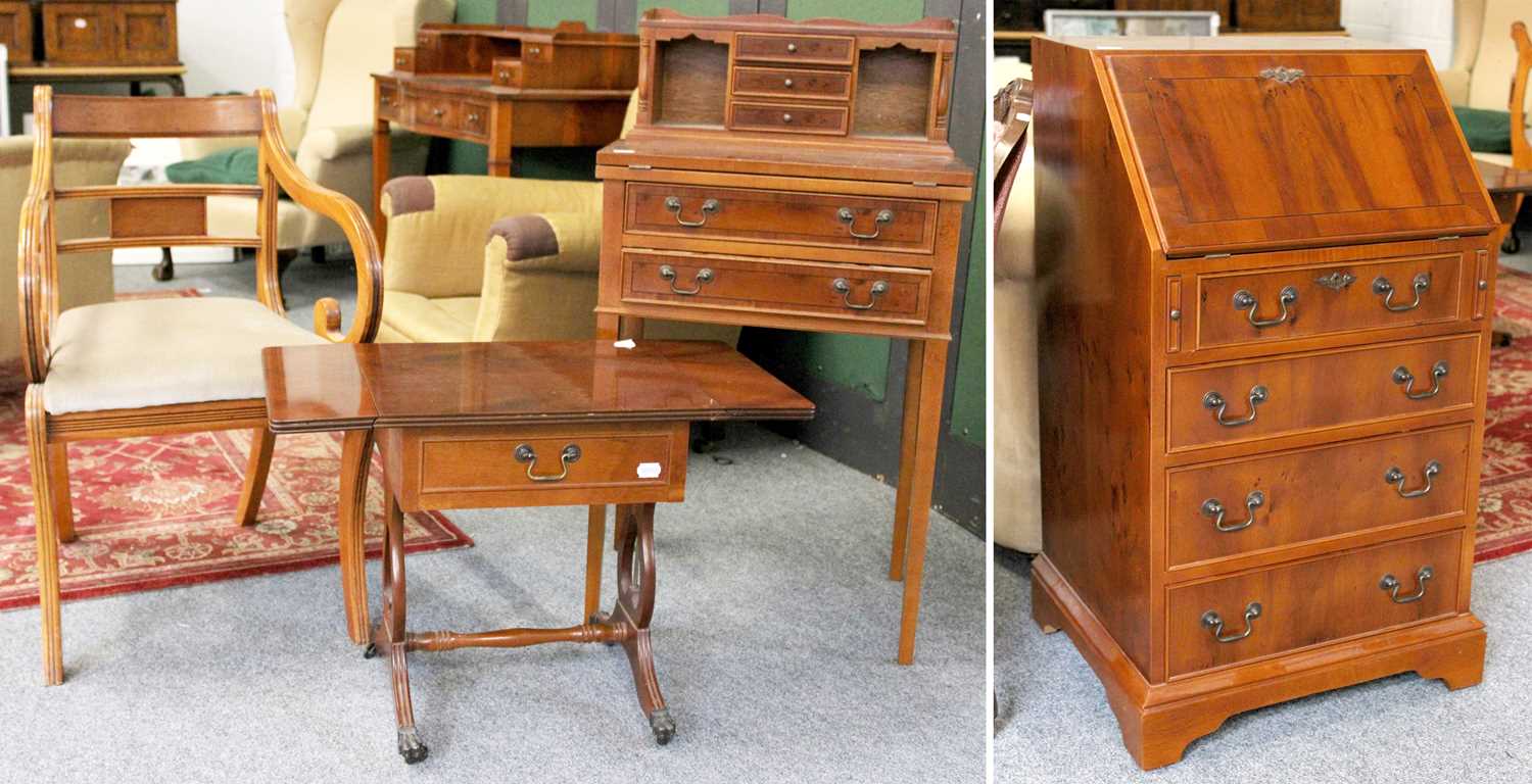 Lot 1139 - A Reproduction Yew Writing Table, the