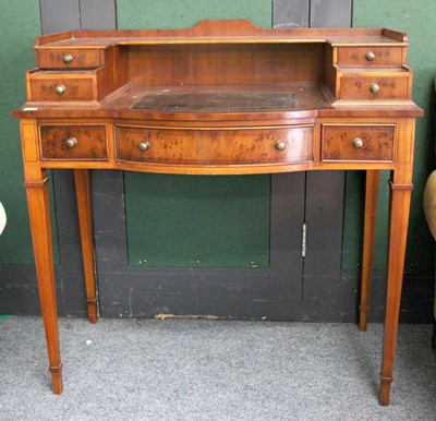 Lot 1142 - A Reproduction Yew Writing Table, with...