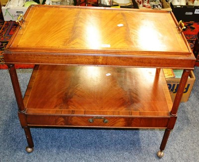 Lot 864 - A reproduction crossbanded mahogany tea trolley with single drawer and serving tray