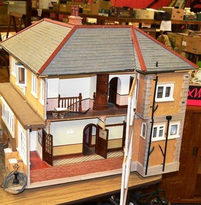 Lot 875 - Modern L-shaped dolls house with papered brick exterior, fully furnished