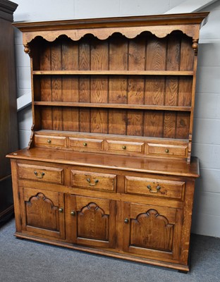 Lot 1327 - A 20th century Oak Dresser and Rack, 157cm by...