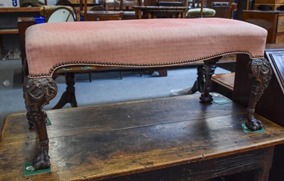 Lot 1297 - A 1920s Carved Mahogany Double Stool, on ball...