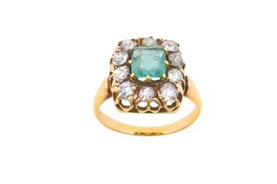 Lot 2104 - An Emerald and Diamond Cluster Ring the...