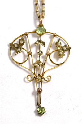 Lot 14 - A peridot and seed pearl pendant on a chain (NB one seed pearl missing)