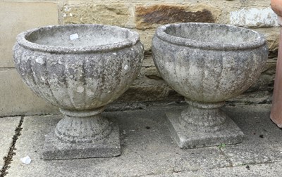 Lot 396 - A Pair of Circular Composition Garden Planters,...