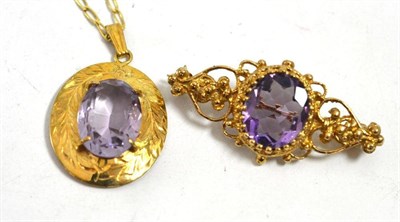 Lot 44 - An amethyst pendant on chain and an amethyst brooch